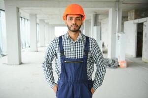 A migrant worker poses for a photo on a city centre construction site in Singapore. The SE Asian city state has a significant migrant worker population