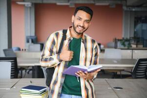 indian student with books at university photo
