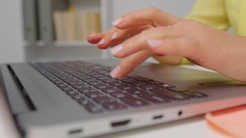 Close up side view hands of professional business woman typing on laptop notebook keyboard. video