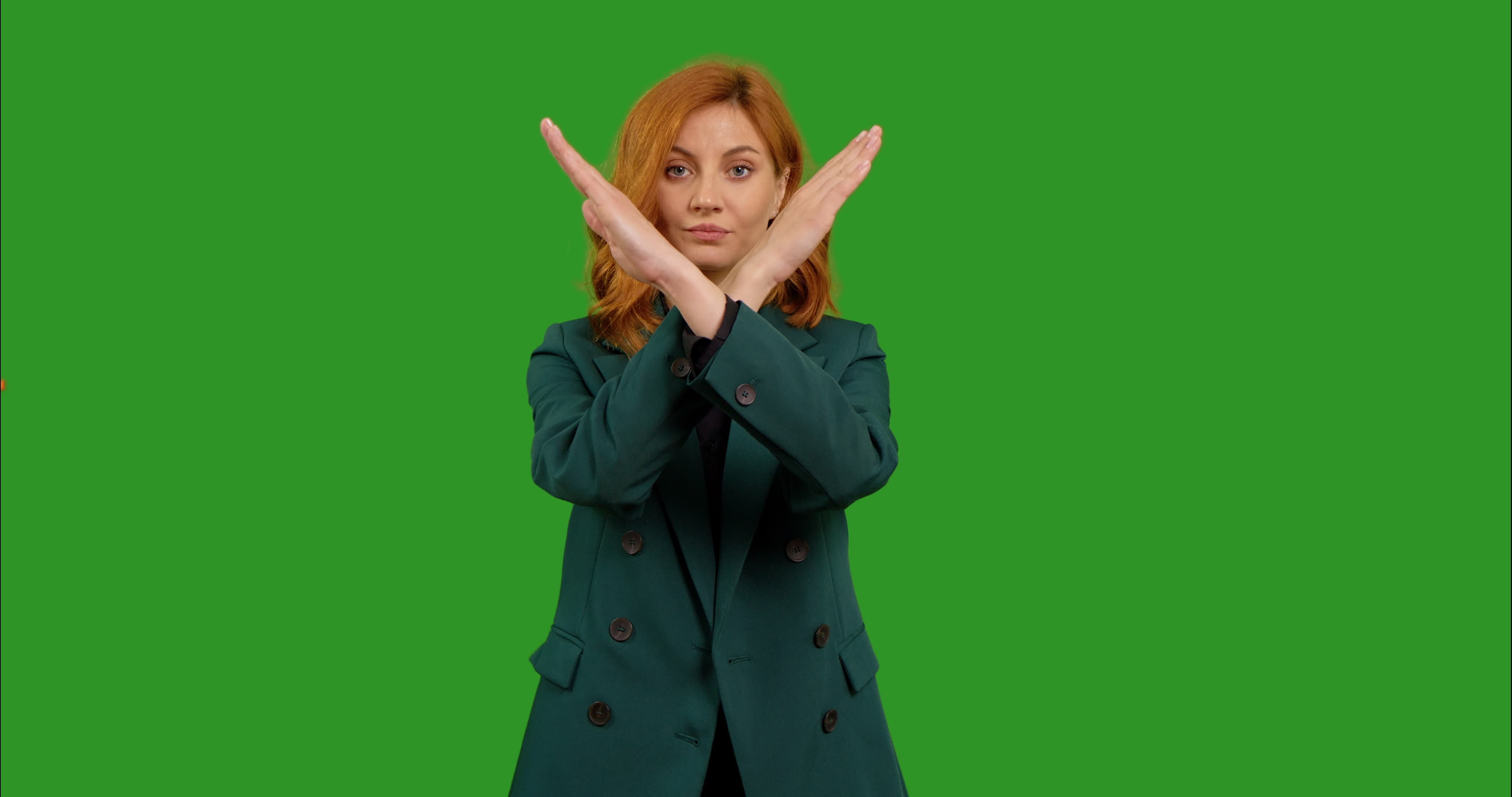 Skeptic woman in showing no crossed hands X Sign on green screen
