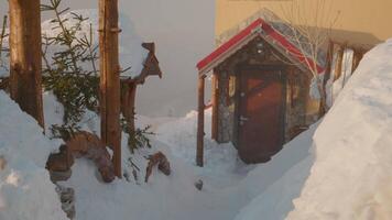 Door entrance to the chalet with narrow passage shot beacuse of heavy snowy day. video