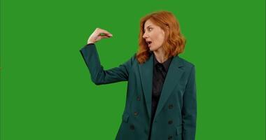 Portrait of woman doing bla-bla-bla gesture while standing in front of the camera on the chroma key background. video