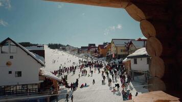Ski track view full with tourists during winter holidays in the mountains. video