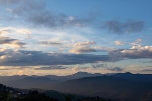 backdrop of the beautiful colors of the sky and the high mountain scenery in Chiang Mai is a beautiful scenery of nature in winter and is popular with tourists. Simple sky background with copy space photo