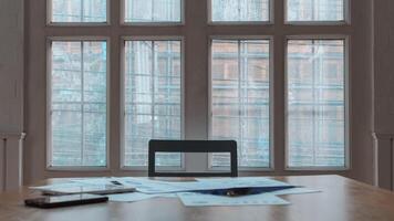 Annual earnings reports are placed on table in the conference room to prepare the paperwork for the board and investors to review annual earnings to adjust and make business plans for the coming year. photo