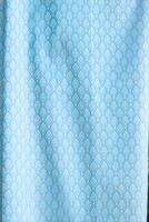 Thai silk with beautiful patterns and a high price because silk is added using ancient methods to produce fibers and weaving with ancient weaving machines resulting in beautiful patterned silk. photo