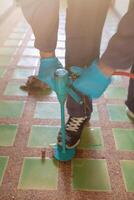 exterminate termite control company employee is using a termite sprayer at customer's house and searching for termite nests to eliminate. exterminate control worker spraying chemical insect repellant photo