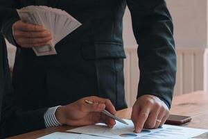 Annual earnings reports are placed on table in the conference room to prepare the paperwork for the board and investors to review annual earnings to adjust and make business plans for the coming year. photo