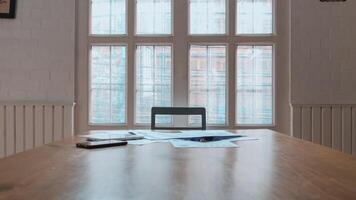 Annual earnings reports are placed on table in the conference room to prepare the paperwork for the board and investors to review annual earnings to adjust and make business plans for the coming year. photo