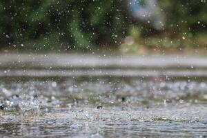 The rain was falling on the roadway due to a precipitation that was forming after the depression hit Thailand, causing heavy rains in some areas and flooding the road surface. photo