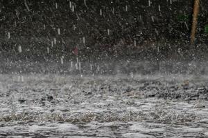 The rain was falling on the roadway due to a precipitation that was forming after the depression hit Thailand, causing heavy rains in some areas and flooding the road surface. photo