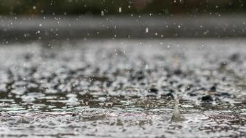 The rain was falling on the roadway due to a precipitation that was forming after the depression hit Thailand, causing heavy rains in some areas and flooding the road surface. photo