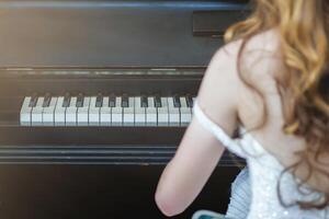 Beautiful piano background are set by the window in the morning waiting for the pianist to come to practice in the morning to reduce the mistake of having to perform the piano performance at a concert photo