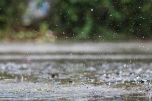 The rain was falling on the roadway due to a precipitation that was forming after the depression hit Thailand, causing heavy rains in some areas and flooding the road surface. photo