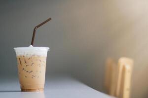 An iced cappuccino caffeinated beverage is placed on counter at customer's order because caffeinated beverage is refreshing and able to work like boss effective.Copy Space for advertisements photo