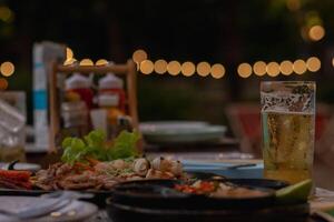The silhouette of a beer mug placed on a table in the pub is a beer mug prepared for tourists as beer is a popular drink and helps to relax after work. photo