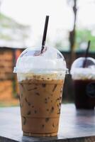 An iced cappuccino caffeinated beverage is placed on counter at customer's order because caffeinated beverage is refreshing and able to work like boss effective.Copy Space for advertisements photo
