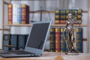 statue of god Themis Lady Justice is used as symbol of justice within law firm demonstrate truthfulness of facts and power to judge without prejudice. hemis Lady Justice symbol of honesty and justice. photo