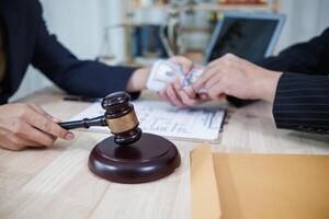 The businessman offered cash to prosecutors as a bribe to help change the verdict in the case, knowing that bribery is a serious and illegal crime. The concept of bribing government officials photo