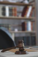 judge's gavel is placed on a table in the legal counsel's office and is often used before verdicts are read to plaintiffs and defendants in court. Legal Counsel Office Decoration Idea with Judge gavel photo