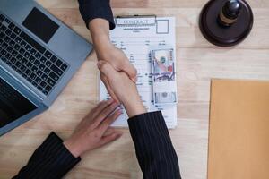 The businessman offered cash to prosecutors as a bribe to help change the verdict in the case, knowing that bribery is a serious and illegal crime. The concept of bribing government officials photo