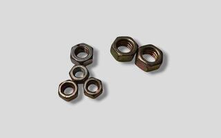 Macro image of metal nut isolated on white background. Steel nut isolated. Tools for work. photo