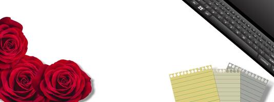 Tropical red roses, computer keyboard and notebook, negative space frame background. Good for additional project design. photo