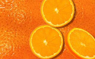 Background of floating falling oranges. Good for use in fruit, beverage and food advertising design projects. photo
