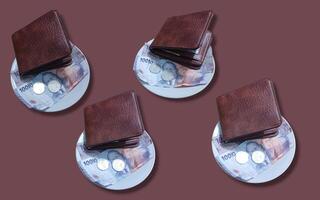 ceramic cup set with wallet and Indonesian rupiah banknotes on brown background. photo