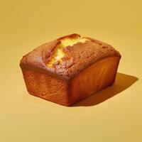 Scrumptious golden loaf cake on a vibrant yellow background photo