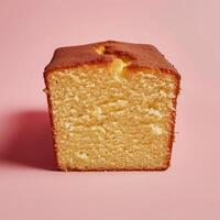 Scrumptious close up view of a moist and fluffy pound cake on a pink background photo