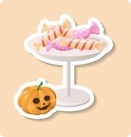 Halloween candies lying on table with jack o lantern pumpkin celebrating halloween vector