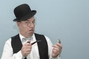 Time has run out. Funny retro sketch portrait of a man. Pocket watch in hand, smoking pipe in hand, and bow tie on. photo