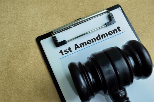 Concept of 1st Amendment write on paperwork isolated on wooden background. photo