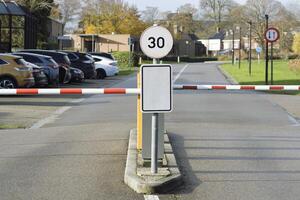 Parking with a barrier for cars for business buildings in the city. Clarification signs with space for text, mockup photo