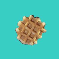 The texture of a standard waffle, on a light blue background. Square format photo