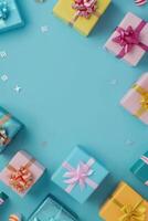 Colorful gift boxes arranged on a blue background with copy space photo