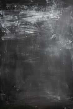 Close-up view of black vertical chalkboard surface with white chalk markings photo