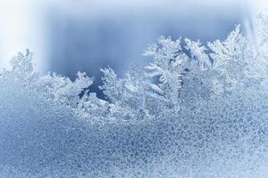 Frosty pattern on the window glass. Abstract, background photo