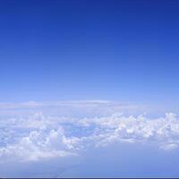 Square gradient blue sky with white fluffy clouds photo