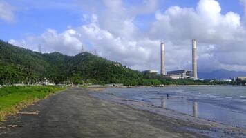 Bbeach, water waves, ocean, building, mountains and clouds photo