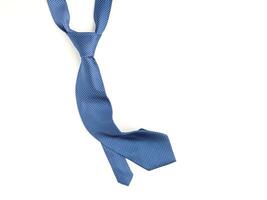 Father's day composition of blue tie laid isolated on a white background. Top view. Flat lay with space for text photo