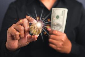 Successful businessman holds a bitcoin coin and US banknote in his hand. Bitcoin a symbol of cryptocurrency - electronic virtual money. Blockchain technology, payment, and digital asset concept photo