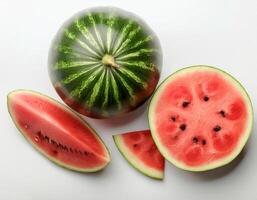 a whole watermelon and a few slices isolated on white background. top of views. photo