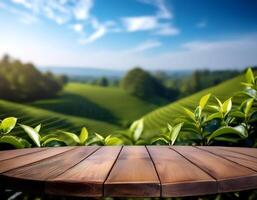 Circle wooden table top with blurred tea plantation landscape with blue sky and blurred green tea garden Natural background product display concept. photo