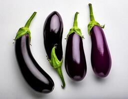 Top of view of fresh eggplant with stem on the white background photo