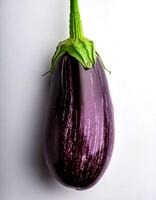 Top of view of fresh eggplant with stem on the white background photo