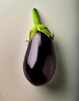 Top of view of fresh eggplant with stem on the white background photo