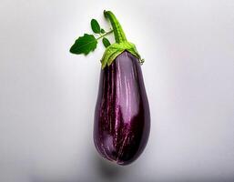 Top of view of fresh eggplant with stem on the white background photo