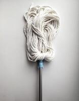 Top of view one mop on the white background photo